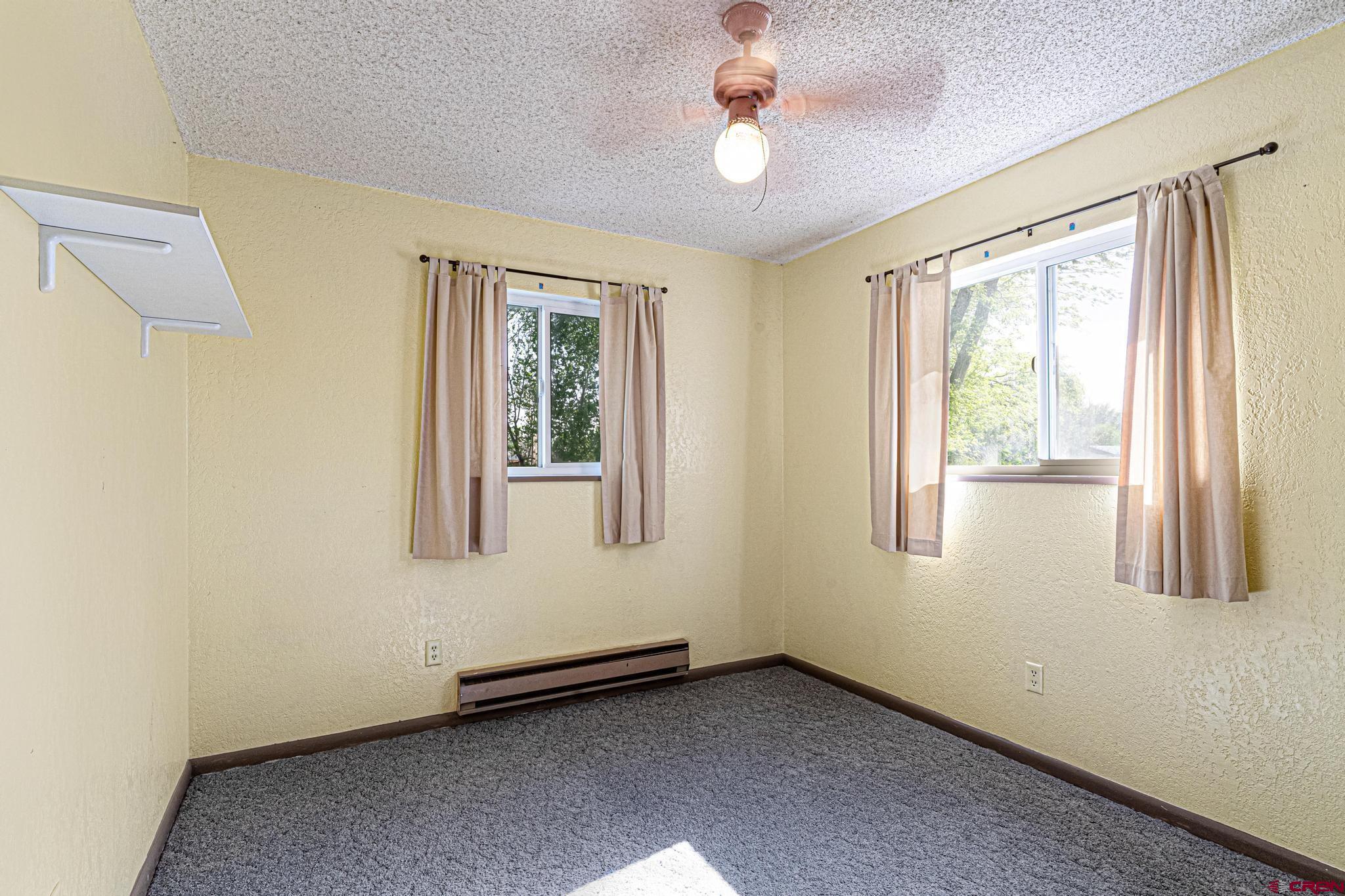 60918 Gunnison Road Montrose, CO 81401 - Photo 30 of 37 a view of an empty room with a window