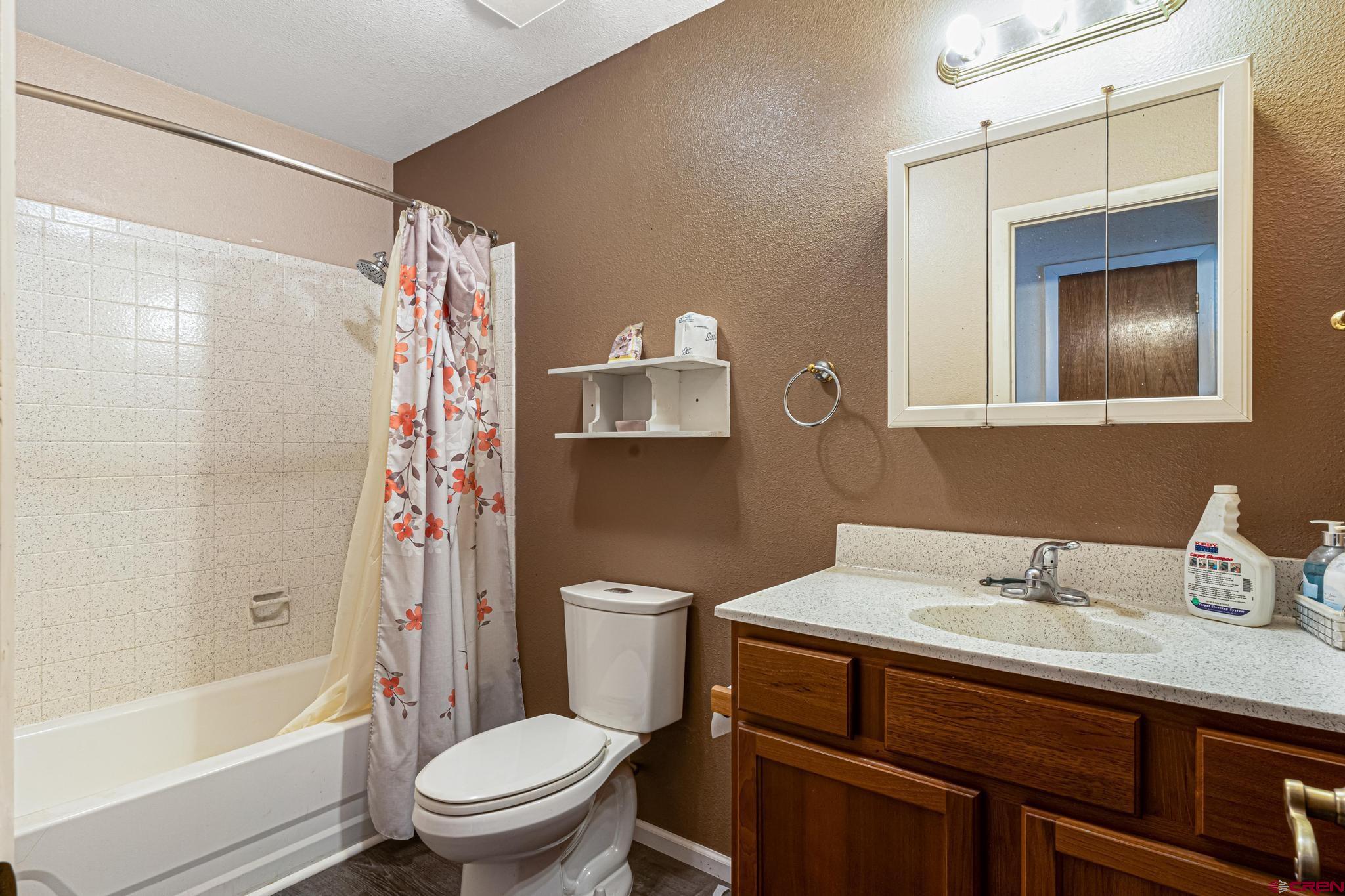 60918 Gunnison Road Montrose, CO 81401 - Photo 32 of 37 a bathroom with a sink toilet and shower