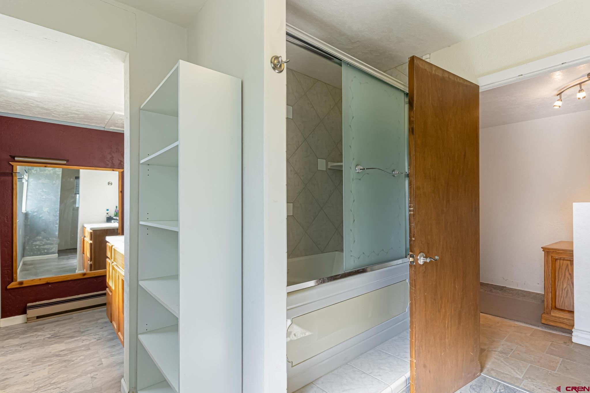 60918 Gunnison Road Montrose, CO 81401 - Photo 36 of 37 a bathroom with a shower and a mirror