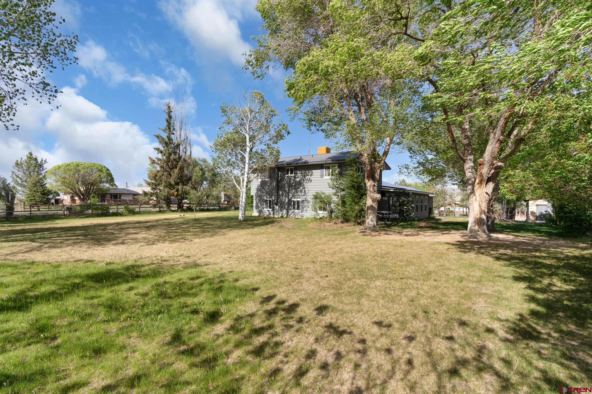 60918 Gunnison Road Montrose, CO 81401 - Photo 5 of 37 a view of road with large trees