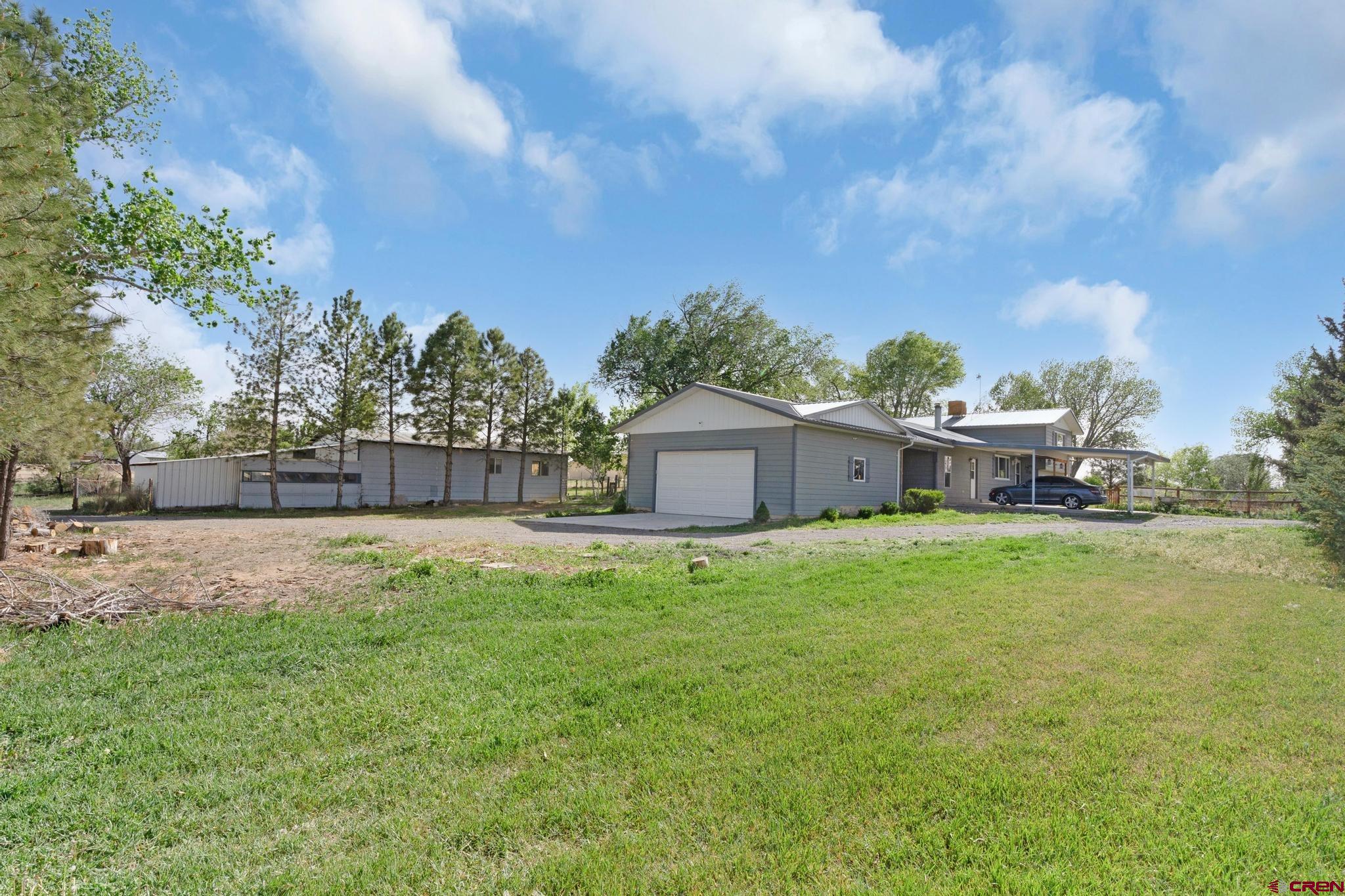 60918 Gunnison Road Montrose, CO 81401 - Photo 8 of 37 a fire hydrant in the middle of a field