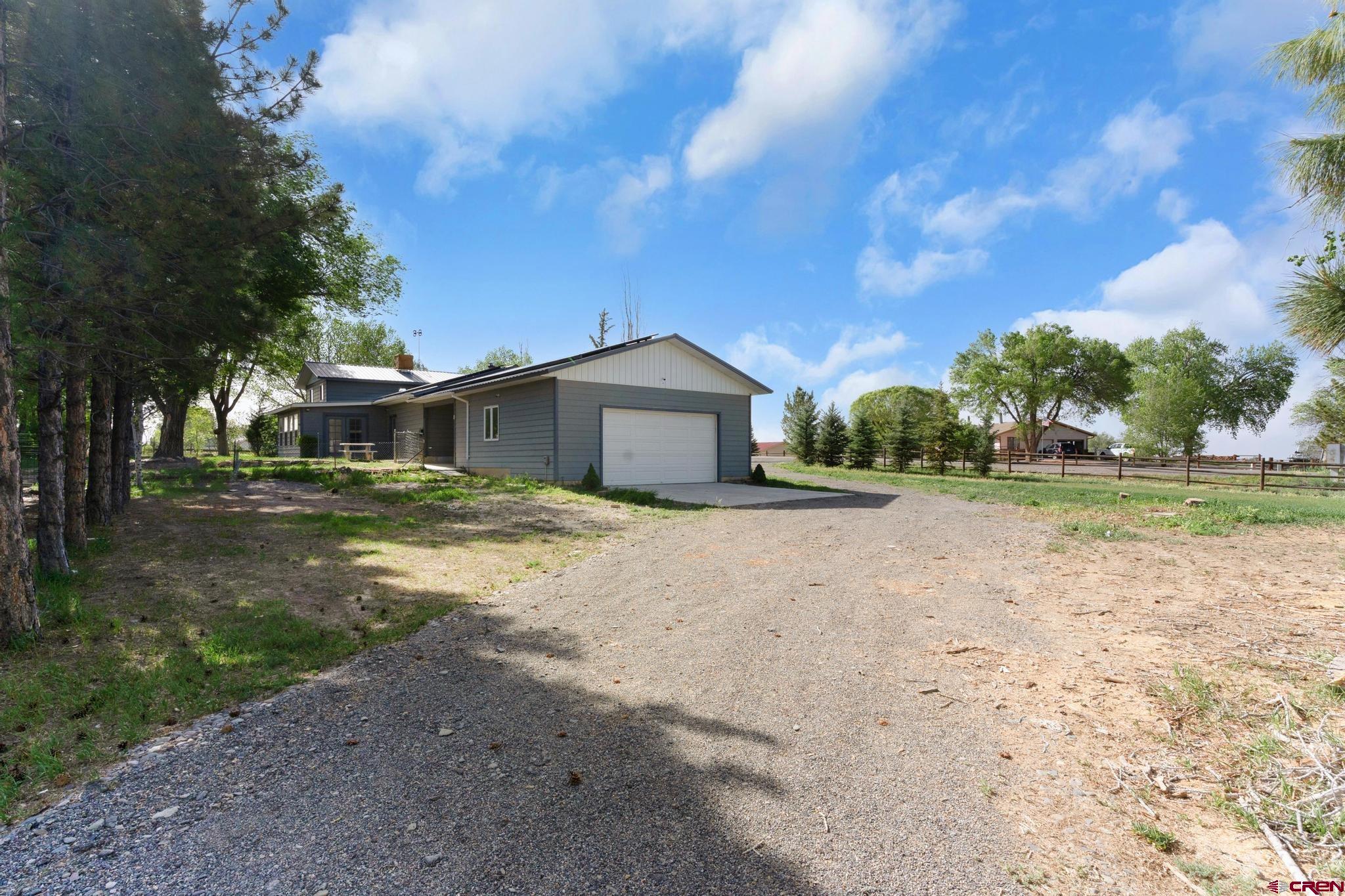 60918 Gunnison Road Montrose, CO 81401 - Photo 9 of 37 a view of house with backyard and tree