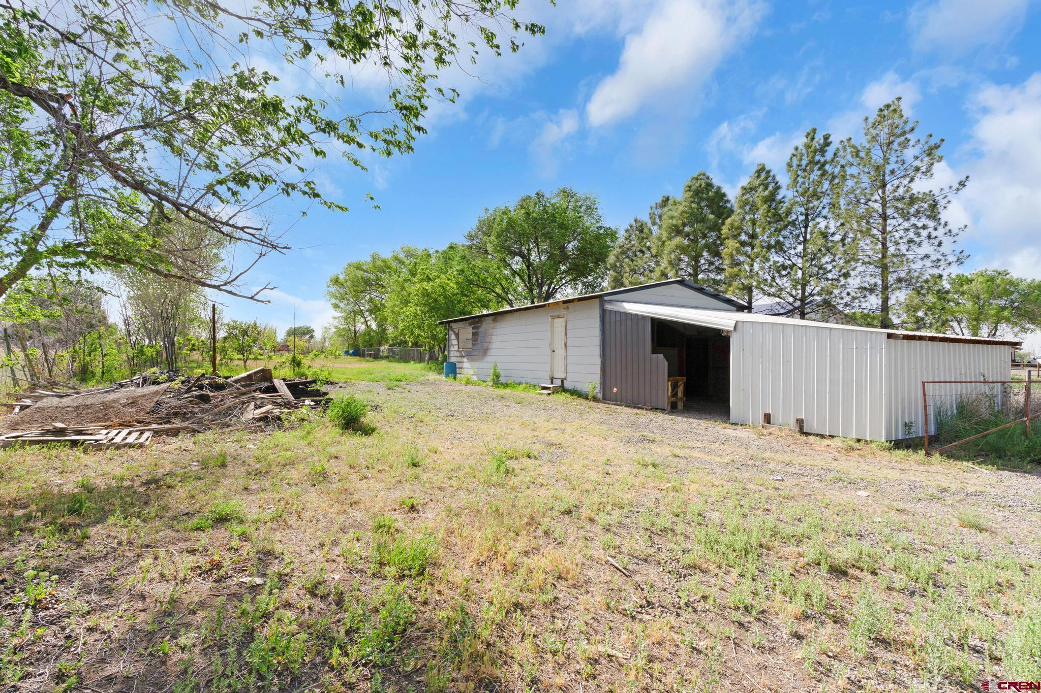 60918 Gunnison Road Montrose, CO 81401 - Photo 10 of 37 a view of a backyard of the house