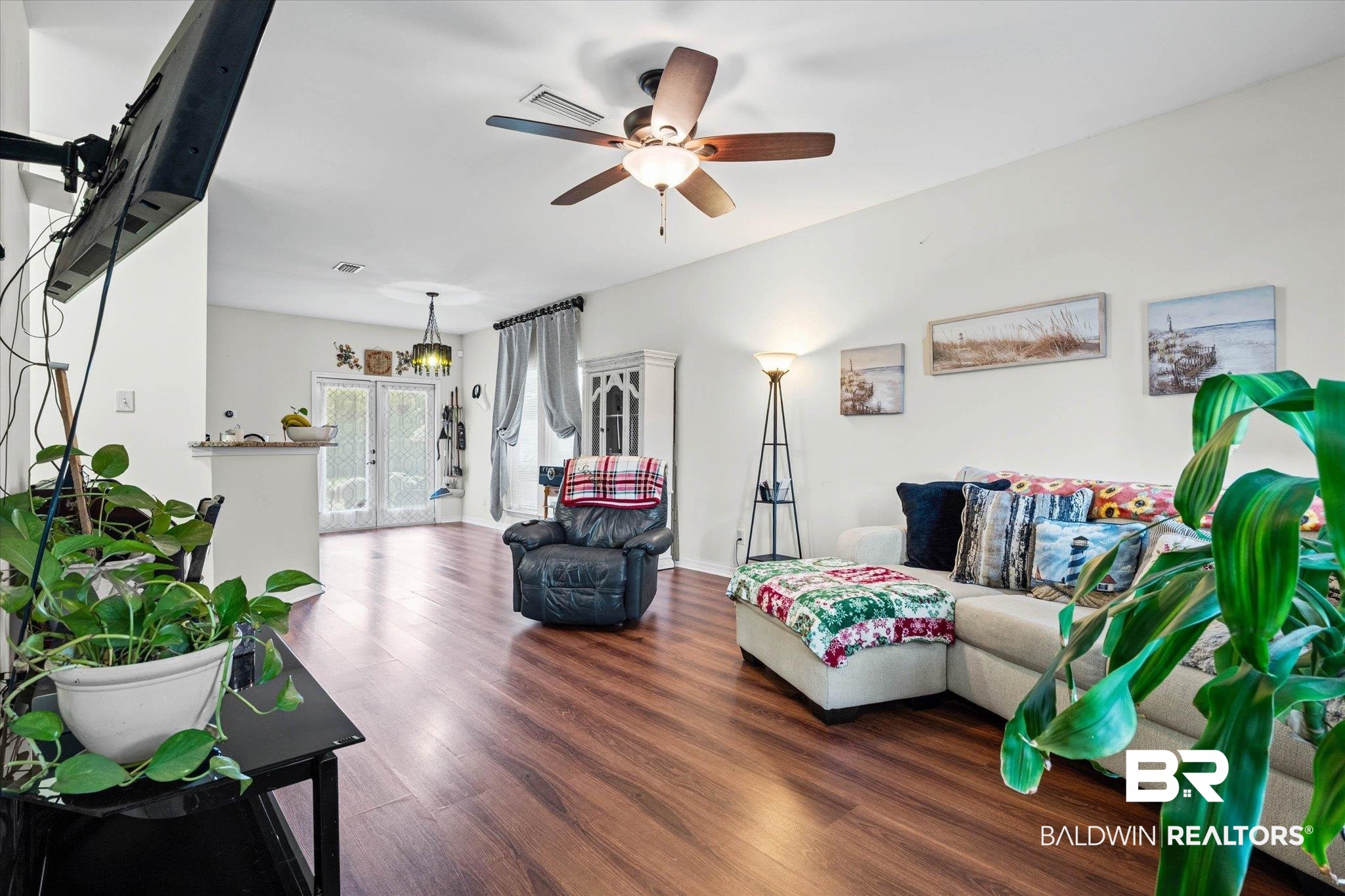 800 Galoway Avenue Mobile, AL 36609 - Photo 3 of 22 Spacious living area featuring wood-finish flooring, a ceiling fan with integrated lighting, and white walls