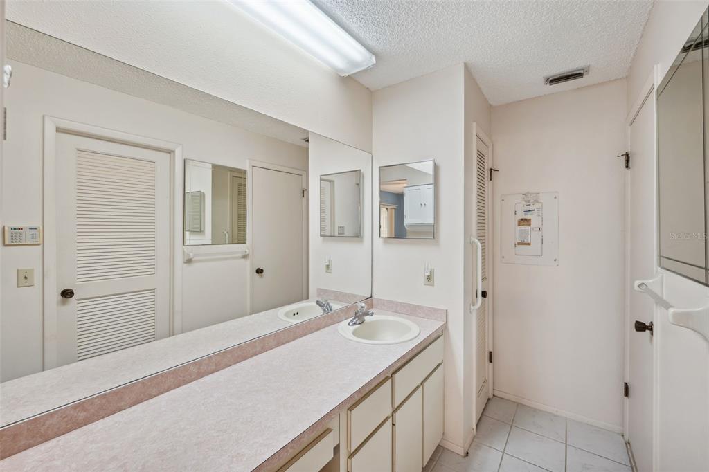6506 Remus Drive New Port Richey, FL 34653 - Photo 13 of 32 a bathroom with a sink and a mirror