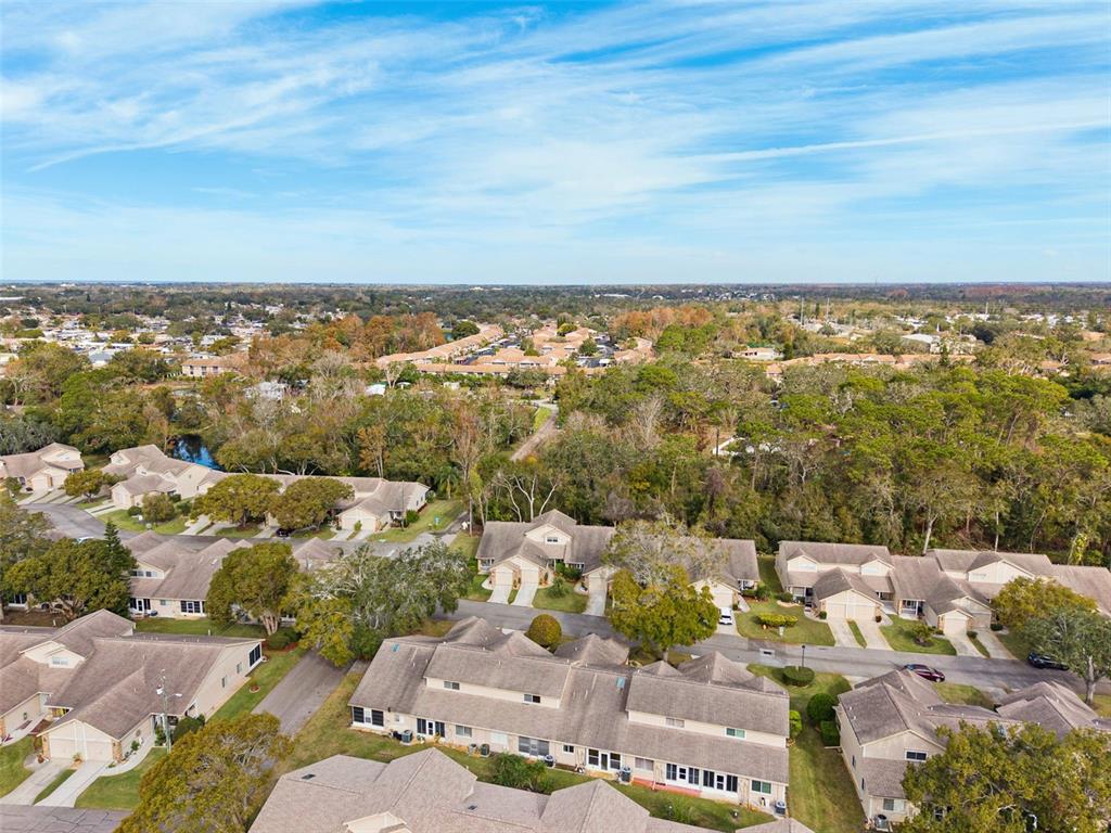 6506 Remus Drive New Port Richey, FL 34653 - Photo 28 of 32 an aerial view of a city with lots of residential buildings