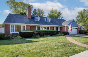 372 Stratford Road Des Plaines, IL 60016 - Photo 1 of 13 a front view of a house with a yard and garage