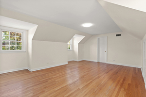 372 Stratford Road Des Plaines, IL 60016 - Photo 12 of 13 an empty room with wooden floor and windows