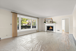 372 Stratford Road Des Plaines, IL 60016 - Photo 2 of 13 a view of empty room with floor to ceiling window and fireplace