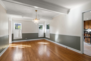 372 Stratford Road Des Plaines, IL 60016 - Photo 3 of 13 a view of livingroom with window and wooden floor