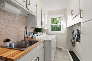 372 Stratford Road Des Plaines, IL 60016 - Photo 7 of 13 a kitchen with stainless steel appliances a sink a refrigerator and a window