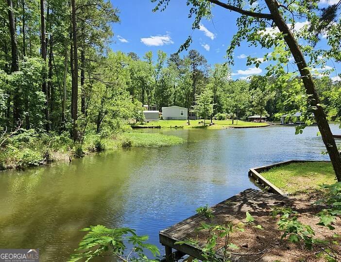 333 Venture Trail Sparta, GA 31087 - Photo 2 of 16 an aerial view of a house with swimming pool a yard and a patio