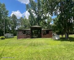 3125 Pacetti Road St. Augustine, FL 32092 - Photo 13 of 14 a view of house with yard and sitting area