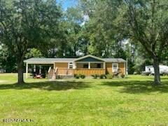 3125 Pacetti Road St. Augustine, FL 32092 - Photo 14 of 14 a front view of a house with a garden