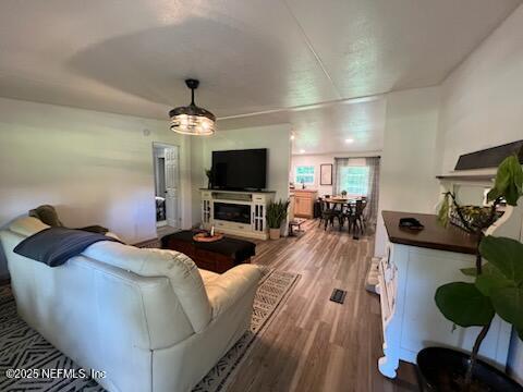 3125 Pacetti Road St. Augustine, FL 32092 - Photo 8 of 14 a living room with furniture a fireplace and a flat screen tv