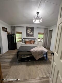 3125 Pacetti Road St. Augustine, FL 32092 - Photo 9 of 14 a bedroom with a bed and a chandelier