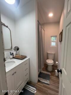 3125 Pacetti Road St. Augustine, FL 32092 - Photo 10 of 14 a bathroom with a toilet a sink and mirror