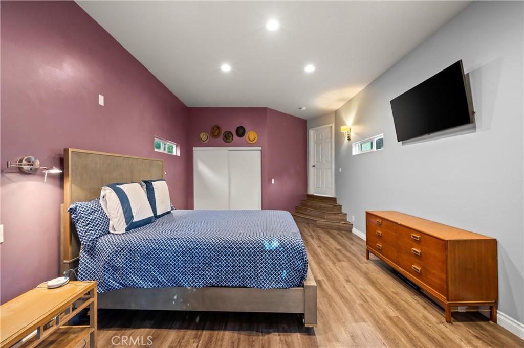 3441 Virginia Road Los Angeles, CA 90016 - Photo 16 of 40 a bedroom with a bed and a flat screen tv