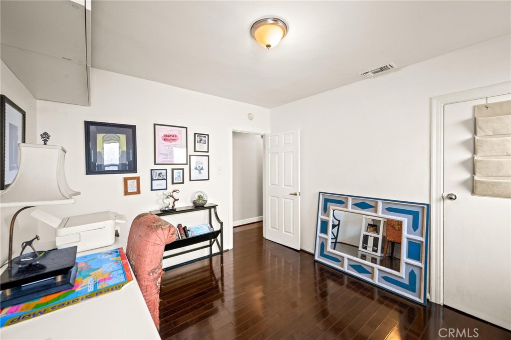 3441 Virginia Road Los Angeles, CA 90016 - Photo 23 of 40 a bedroom with furniture and a wooden floor