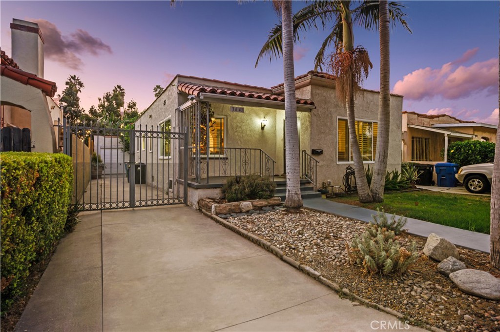 3441 Virginia Road Los Angeles, CA 90016 - Photo 34 of 40 a pathway to a house with a yard