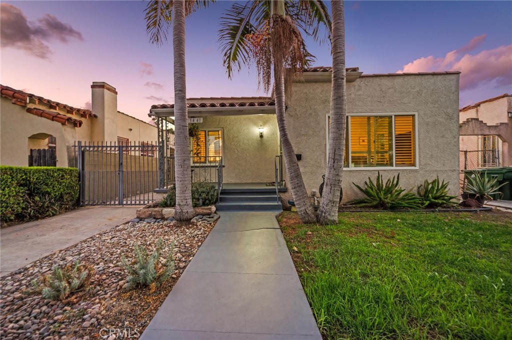 3441 Virginia Road Los Angeles, CA 90016 - Photo 35 of 40 a front view of a house with a yard