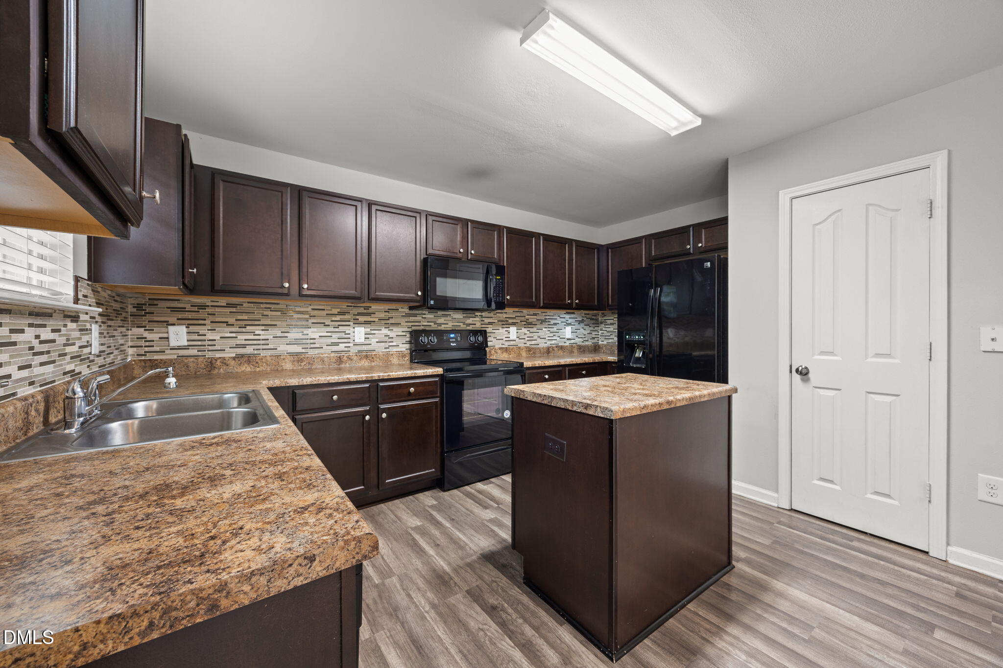 45 Crane Way Bunnlevel, NC 28323 - Photo 13 of 35 a kitchen with a stove sink and cabinets