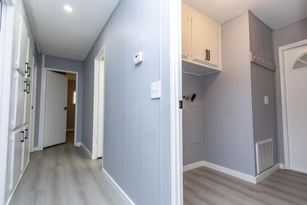 520 Allen Way Turlock, CA 95380 - Photo 17 of 39 a view of a hallway with wooden floor