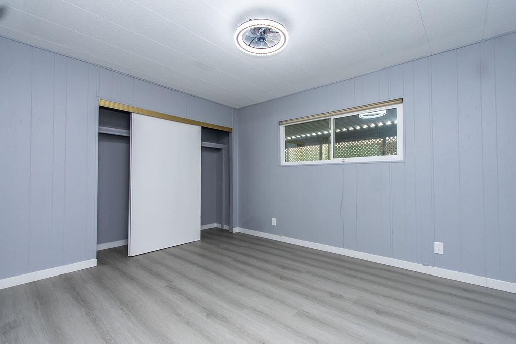 520 Allen Way Turlock, CA 95380 - Photo 19 of 39 an empty room with wooden floor and window