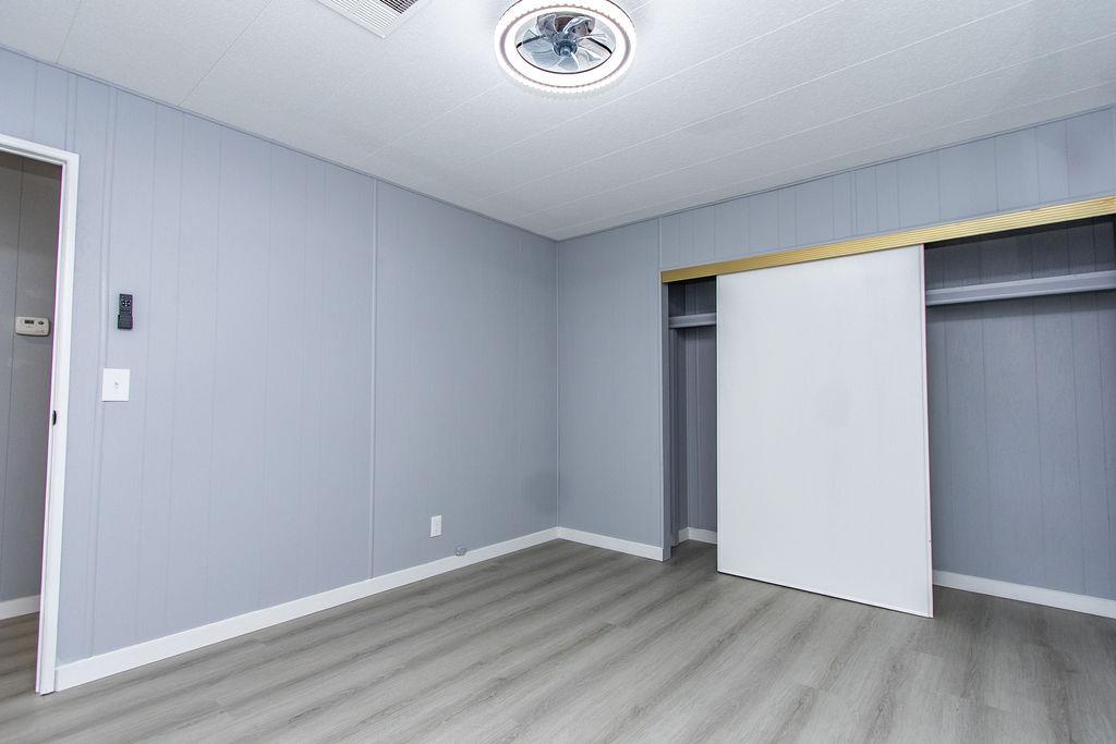 520 Allen Way Turlock, CA 95380 - Photo 20 of 39 a view of an empty room with wooden floor