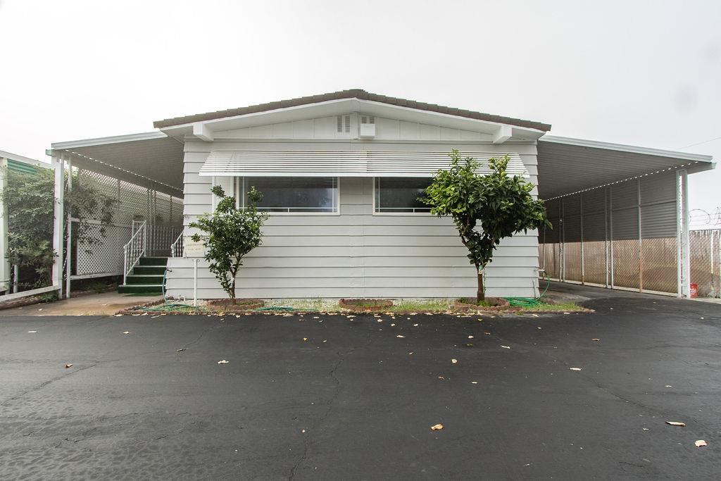 520 Allen Way Turlock, CA 95380 - Photo 2 of 39 a front view of a house with a yard and garage