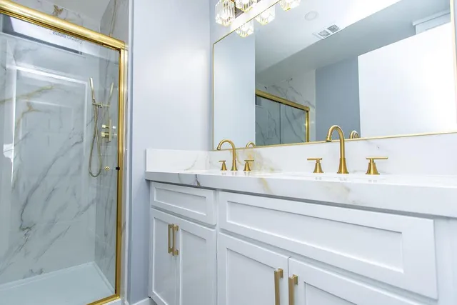 a bathroom with a sink and a mirror