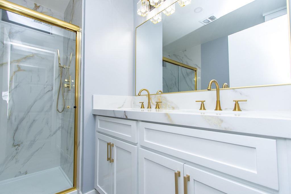 520 Allen Way Turlock, CA 95380 - Photo 21 of 39 a bathroom with a sink and a mirror