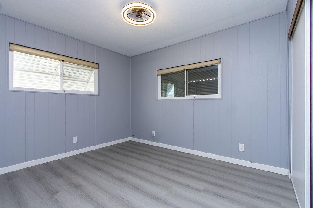 520 Allen Way Turlock, CA 95380 - Photo 23 of 39 a view of an empty room with wooden floor and a window