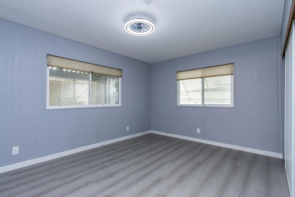 520 Allen Way Turlock, CA 95380 - Photo 25 of 39 a view of a room with wooden floor and windows