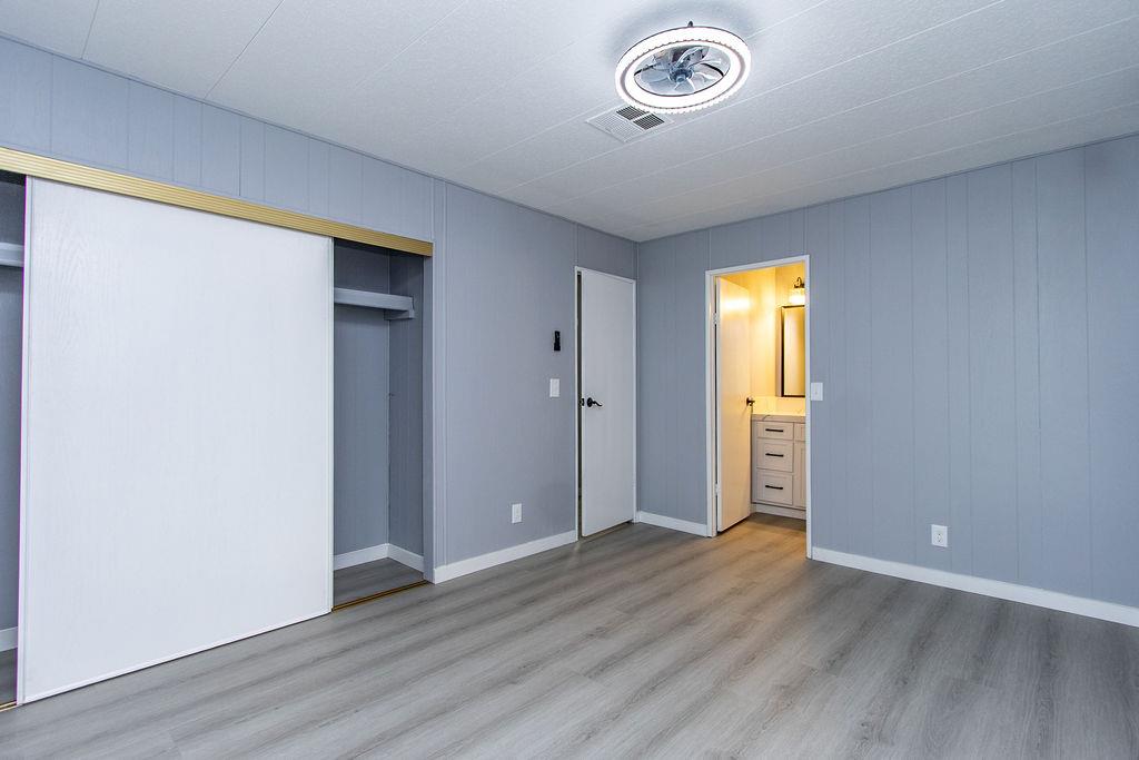 520 Allen Way Turlock, CA 95380 - Photo 26 of 39 an empty room with a window and wooden floor