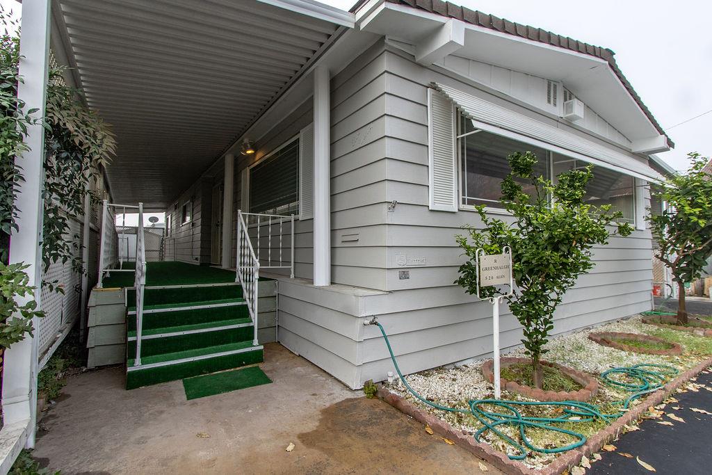 520 Allen Way Turlock, CA 95380 - Photo 34 of 39 a front view of a house with a garden