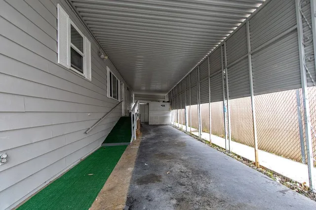 a view of a house with a backyard