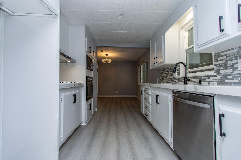 520 Allen Way Turlock, CA 95380 - Photo 10 of 39 a kitchen with a sink and a refrigerator