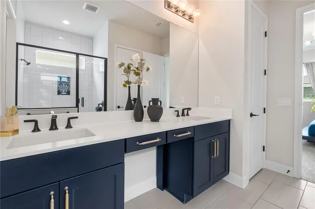 a bathroom with a double vanity sink and a mirror