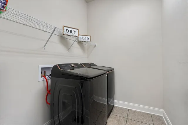 a utility room with dryer and washer