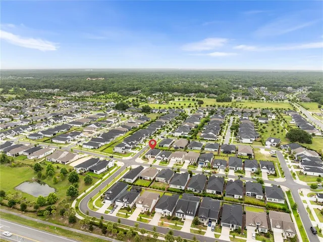 an aerial view of residential building with parking space