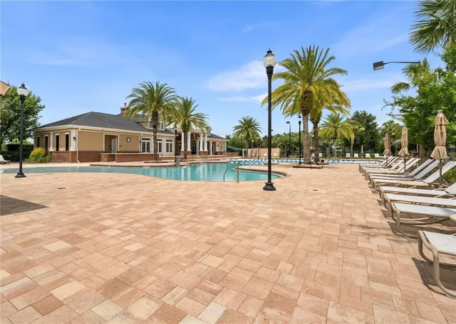 a view of outdoor space with swimming pool and lounge chair