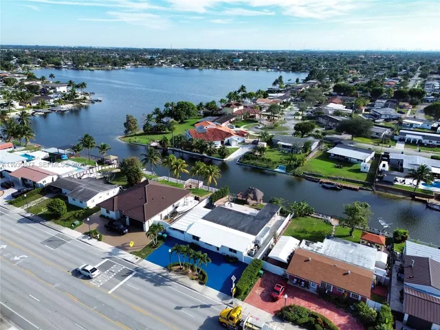 an aerial view of a houses with outdoor space