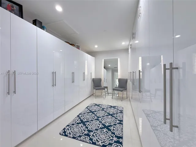 a bathroom with a sink vanity mirror and shower