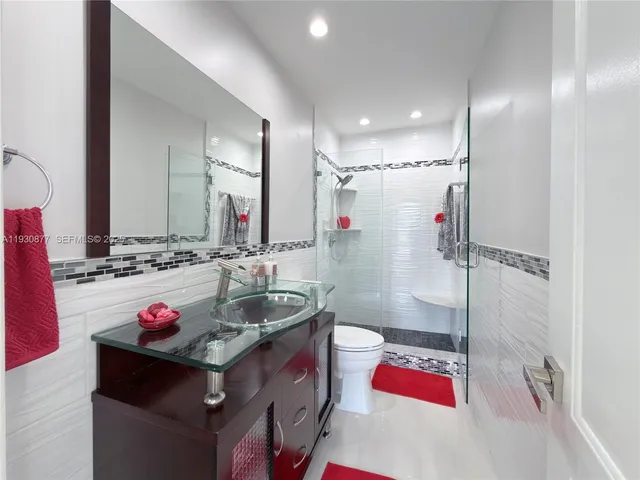 a view of a hallway with white walls