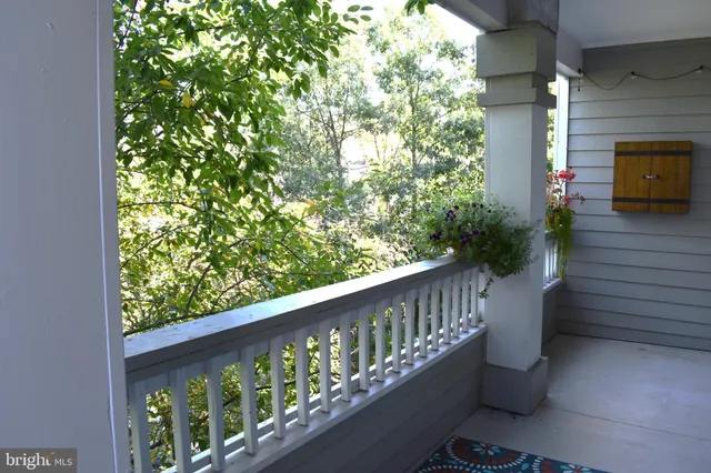 a balcony with wooden floor