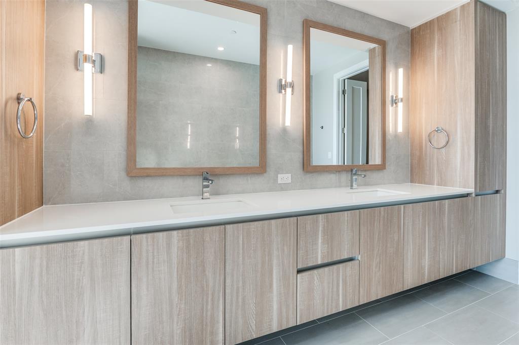3003 Maple Avenue, Unit 2220 Dallas, TX 75201 - Photo 11 of 40 a bathroom with a double vanity sink and a mirror