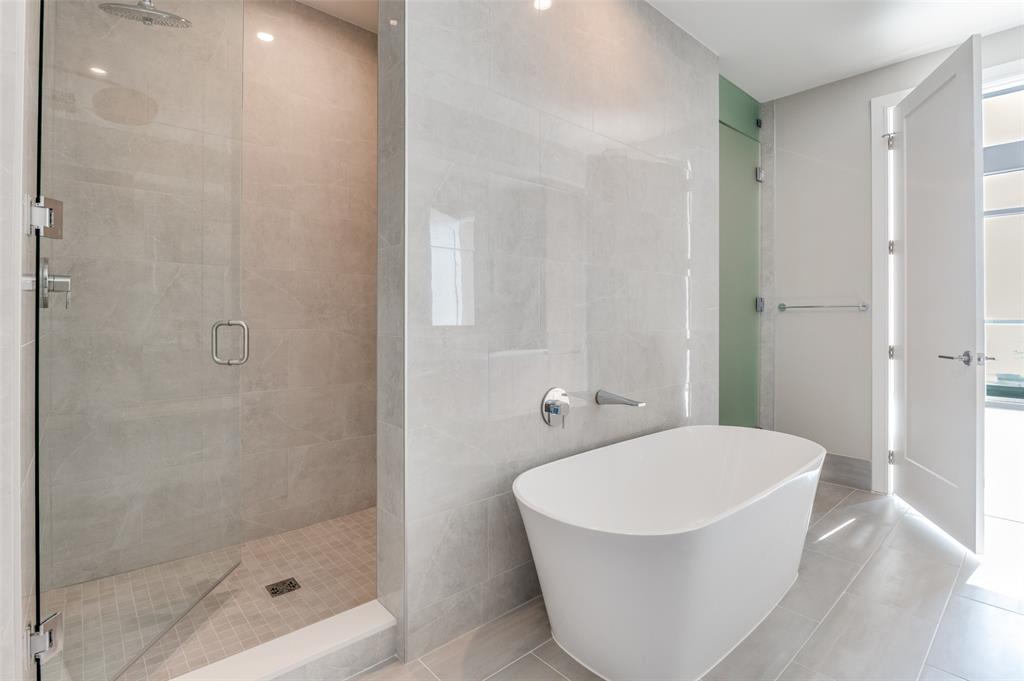 3003 Maple Avenue, Unit 2220 Dallas, TX 75201 - Photo 12 of 40 a white bath tub sitting next to a white sink