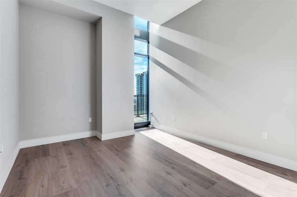 3003 Maple Avenue, Unit 2220 Dallas, TX 75201 - Photo 16 of 40 wooden floor in an empty room