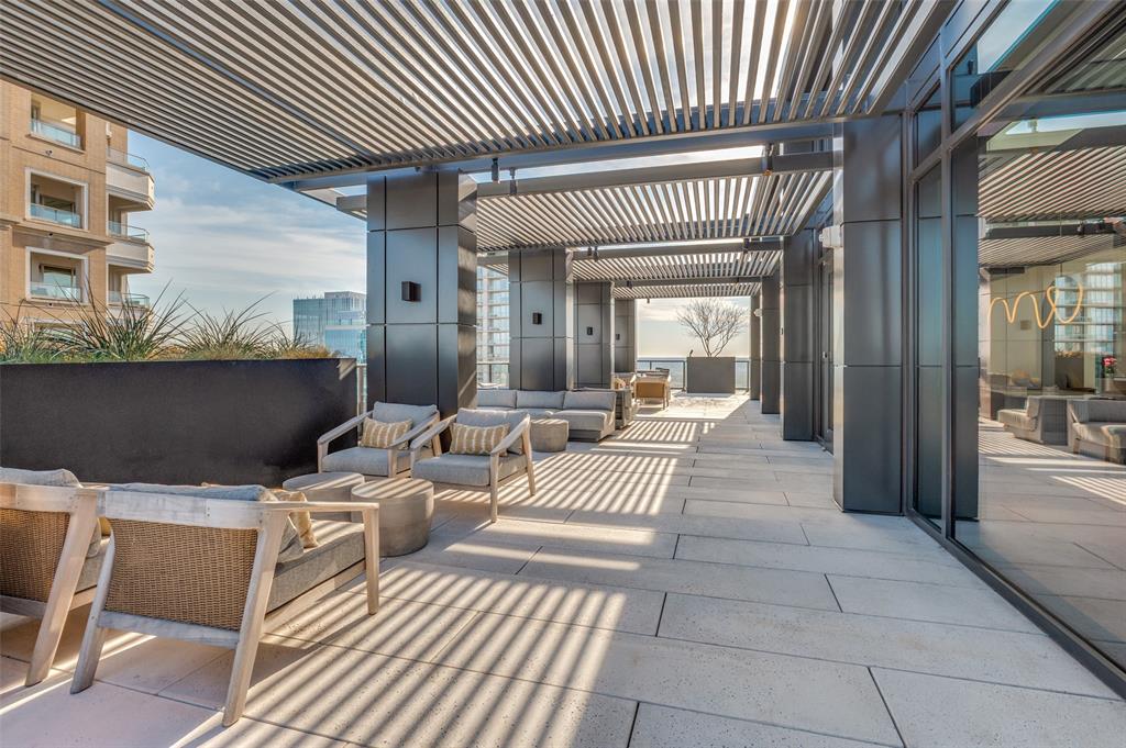 3003 Maple Avenue, Unit 2220 Dallas, TX 75201 - Photo 20 of 40 a view of a patio with table and chairs